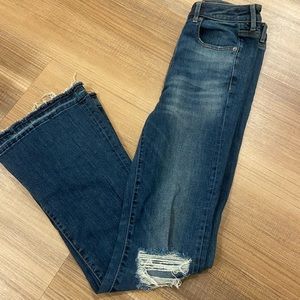 Distressed flare jeans